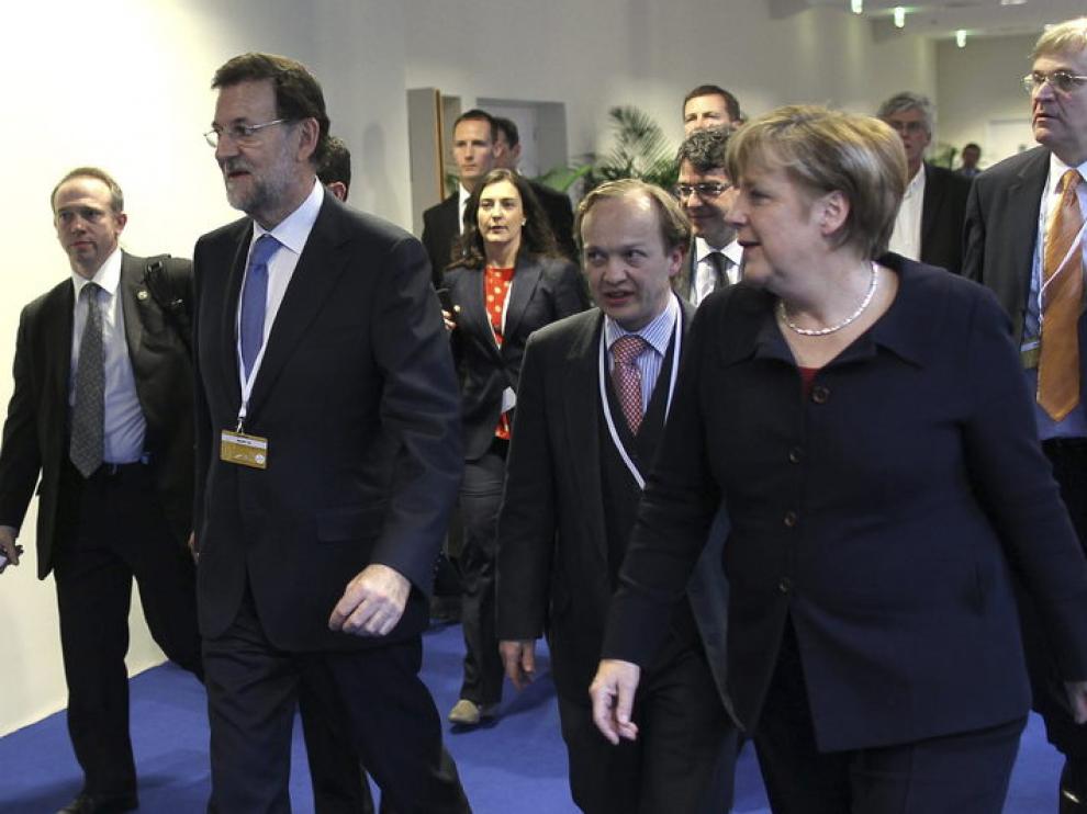 Rajoy y Merkel, en Francia
