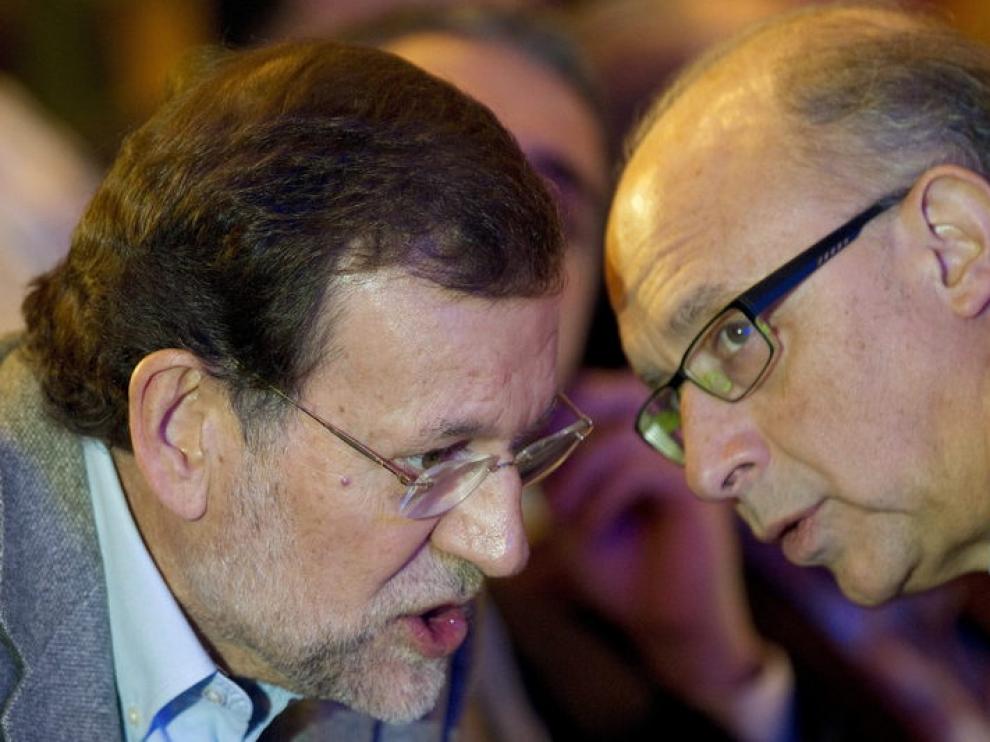 Rajoy y Montoro durante la convención autonómica del PP en Málaga.