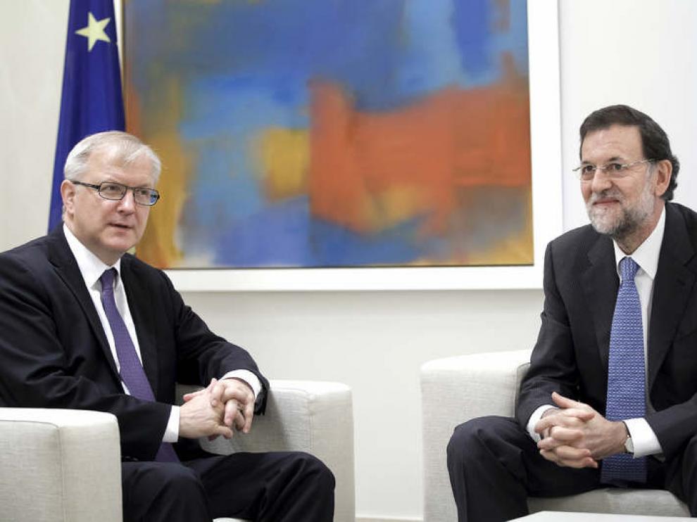 Olli Rehn y Mariano Rajoy
