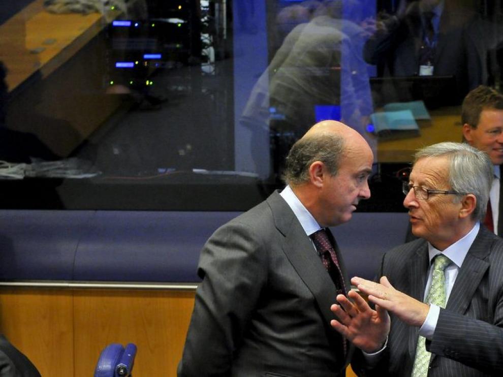 Luis de Guindos y Jean-Claude Juncker