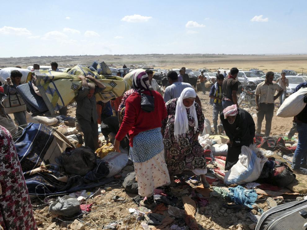 Refugiados sirios, en la frontera con Turquía, huyendo del Estado Islámico