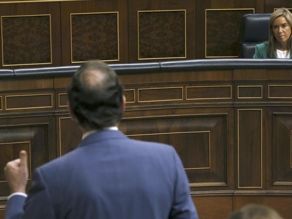 Mato y Rajoy durante la sesión de control al Gobierno