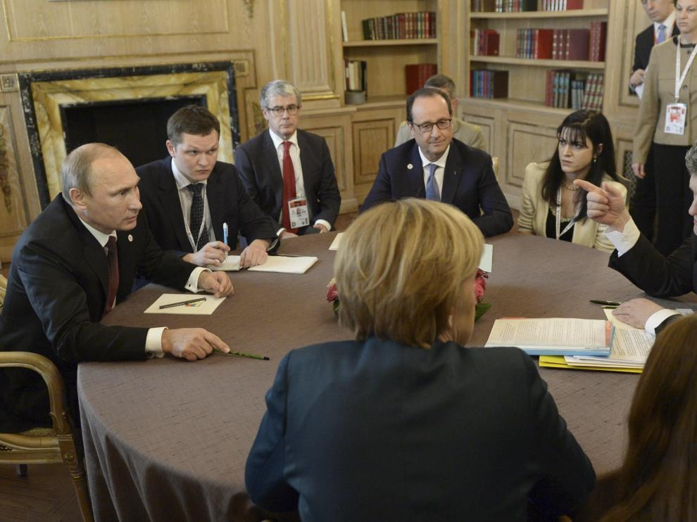 Putin y Poroshenko durante reuniones bilaterales