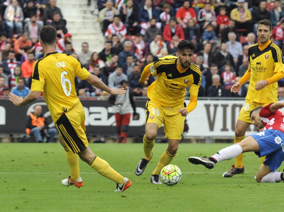 Una imagen del duelo entre el Osasuna y el Girona en Montilivi
