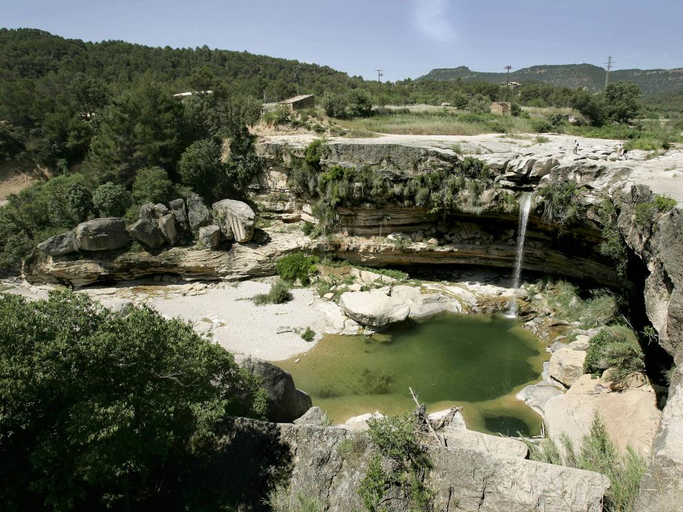 El paraje de 'El Salto', cascada formada por el río Tastavins en el término municipal de La Portellada.
