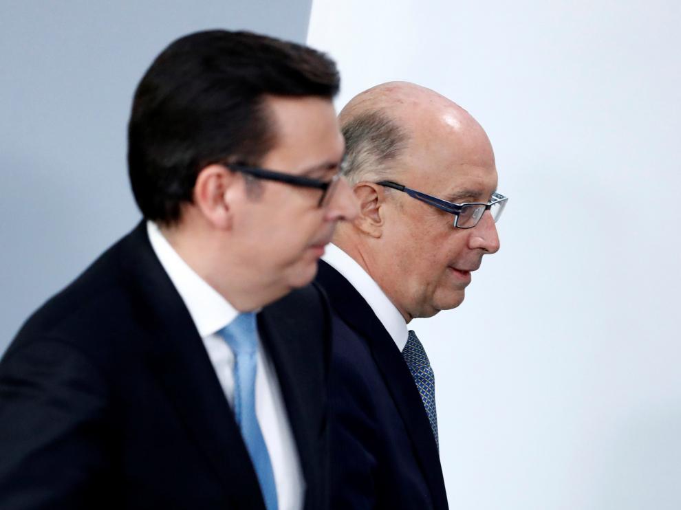 El ministro de Economia, Román Escolano, y el de Hacienda, Cristóbal Montoro.
