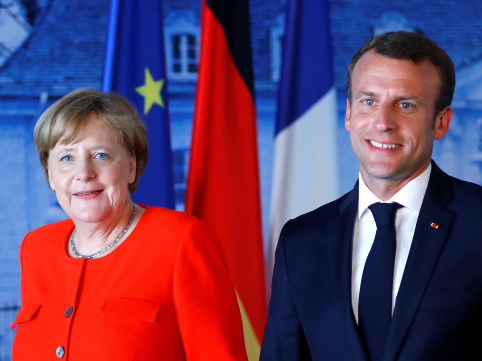 Merkel y Macron acuerdan reforzar las fronteras de la UE y limitar el asilo en los países de entrada
