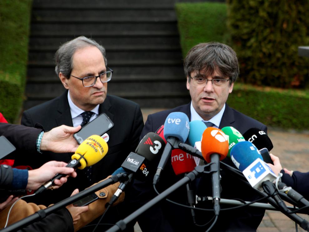 El expresidente de la Generalitat, Carles Puigdemont, junto al presidente de la Generalitat, Quim Torra.