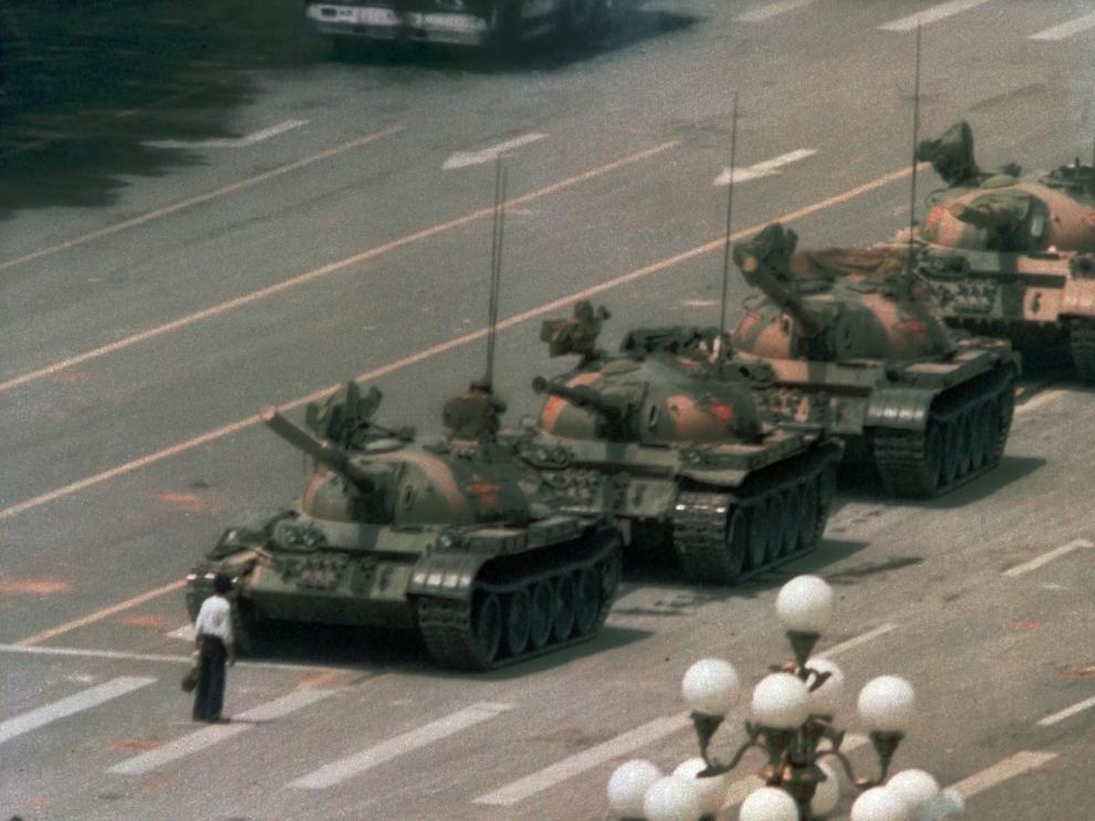 ** FILE ** A Chinese man stands alone to block a line of tanks heading east on Beijing's Changan Blvd. near Tiananmen Square in this June 5, 1989 file photo. Friday June 4, 2004 marks the 15th anniversary of the military crackdown on a student-led demonstration for democratic reform and against government corruption, which left hundreds, possibly thousands dead. (AP Photo/Jeff Widener, File) CHINA TIANANMEN ANNIVERSARY