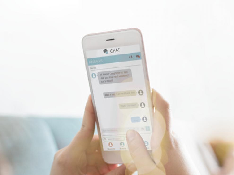 Woman texting on a couch