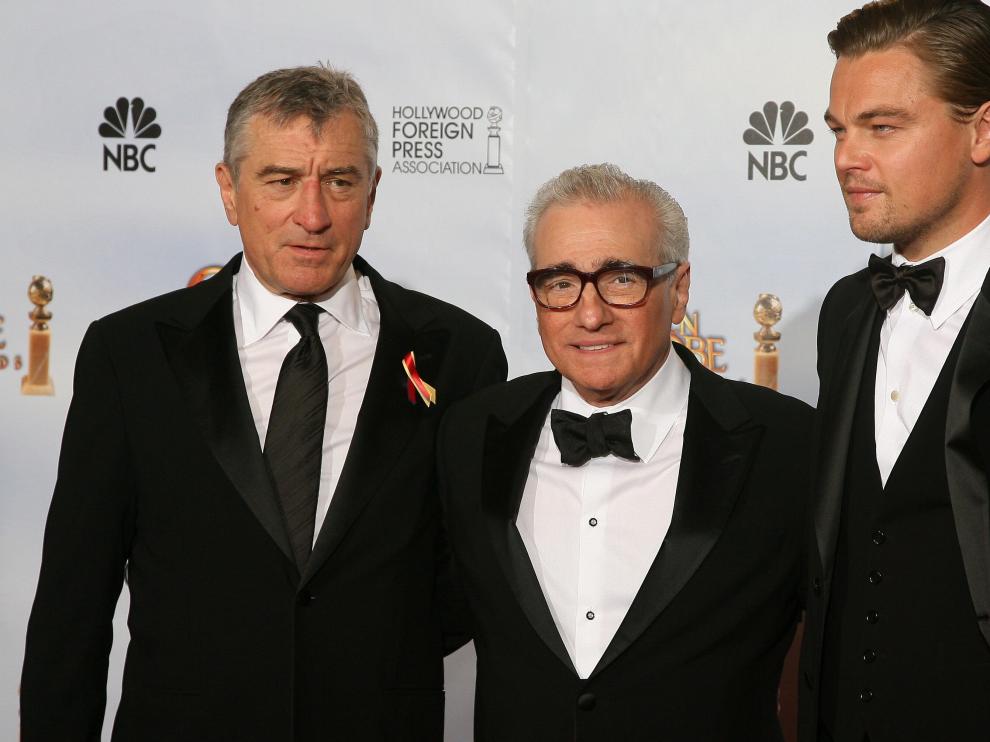 Oscar-winning director Martin Scorsese (C) stands with US actors Leondardo DiCaprio (R) and Robert De Niro (L), who presented Scorsese the Golden Globes Cecil B. DeMille Award for his "outstanding contribution to the entertainment field" during the 67th Golden Globe Awards on January 17, 2010 in Beverly Hills, California. The veteran film-maker, director of classic films including "Raging Bull," "Goodfellas" and "The Aviator," has already received two best director Globes during his career for "The Departed" and "Gangs of New York." AFP PHOTO / Valerie MACON US-GOLDEN GLOBES-SCORSESE