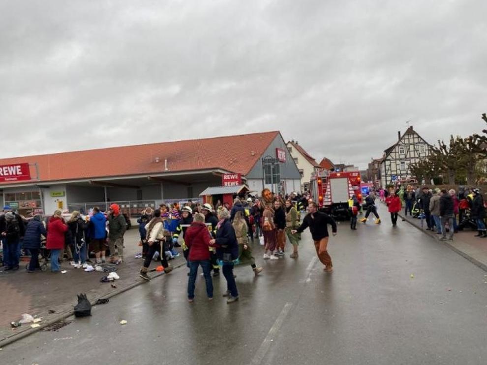 People react at the scene after a car ploughed into a carnival parade injuring several people in Volkmarsen