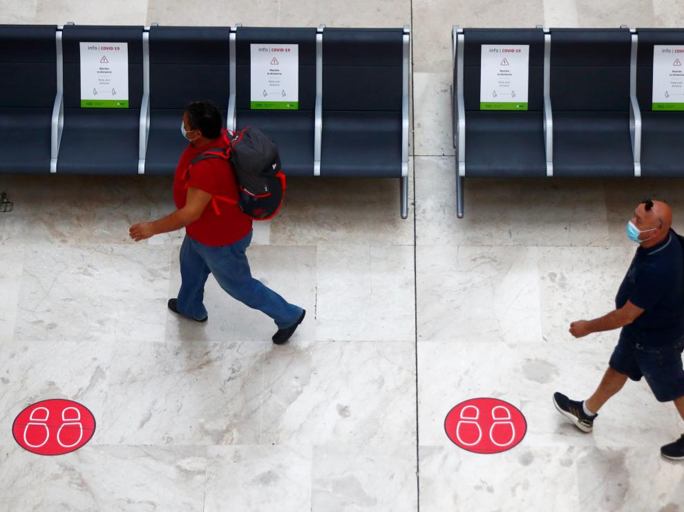 Passengers arrive at Adolfo Suarez Barajas airport in Madrid