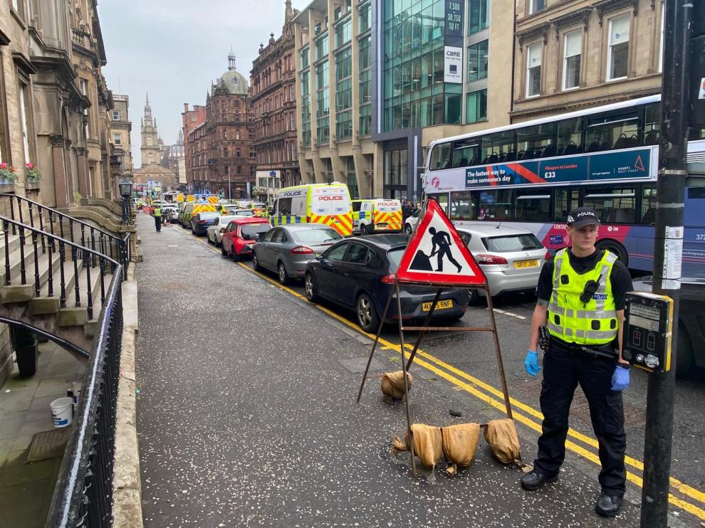 Emergency respoders are seen near a scene of reported stabbings, in Glasgow