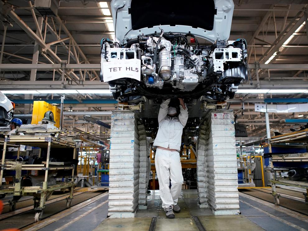 FILE PHOTO: Employee works on a production line inside a Dongfeng Honda factory in Wuhan