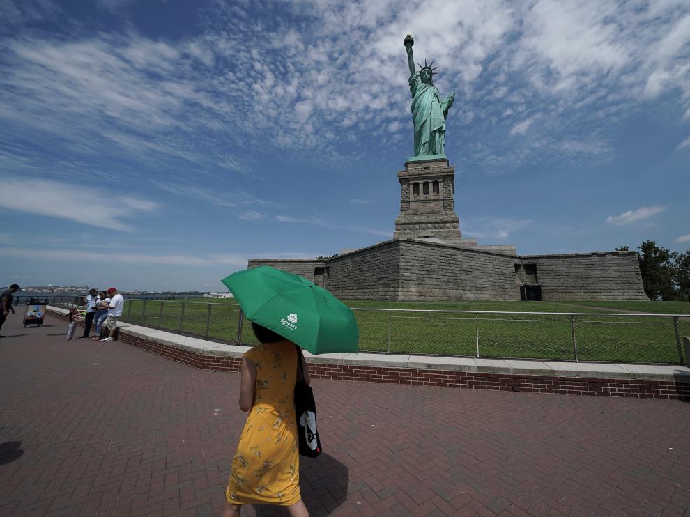 People are seen at the Statue of Liberty as New York enters Phase 4 of reopening following the outbreak of the coronavirus disease (COVID-19) in New York City