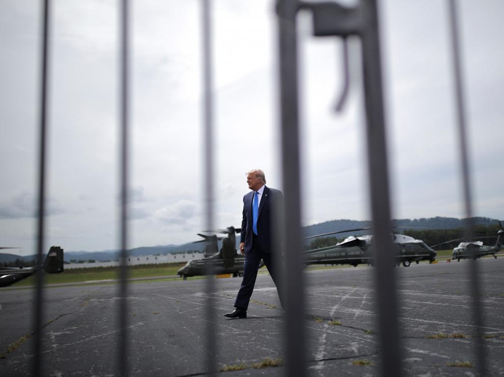 U.S. President Donald Trump greets supporters on a tarmac after he arrived by helicopter at Asheville Regional Airport in Asheville, North Carolina