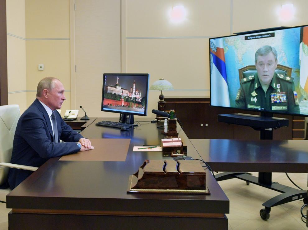 Russian President Putin meets with Chief of the Russian Armed Forces' General Staff Gerasimov via a video conference call, outside Moscow