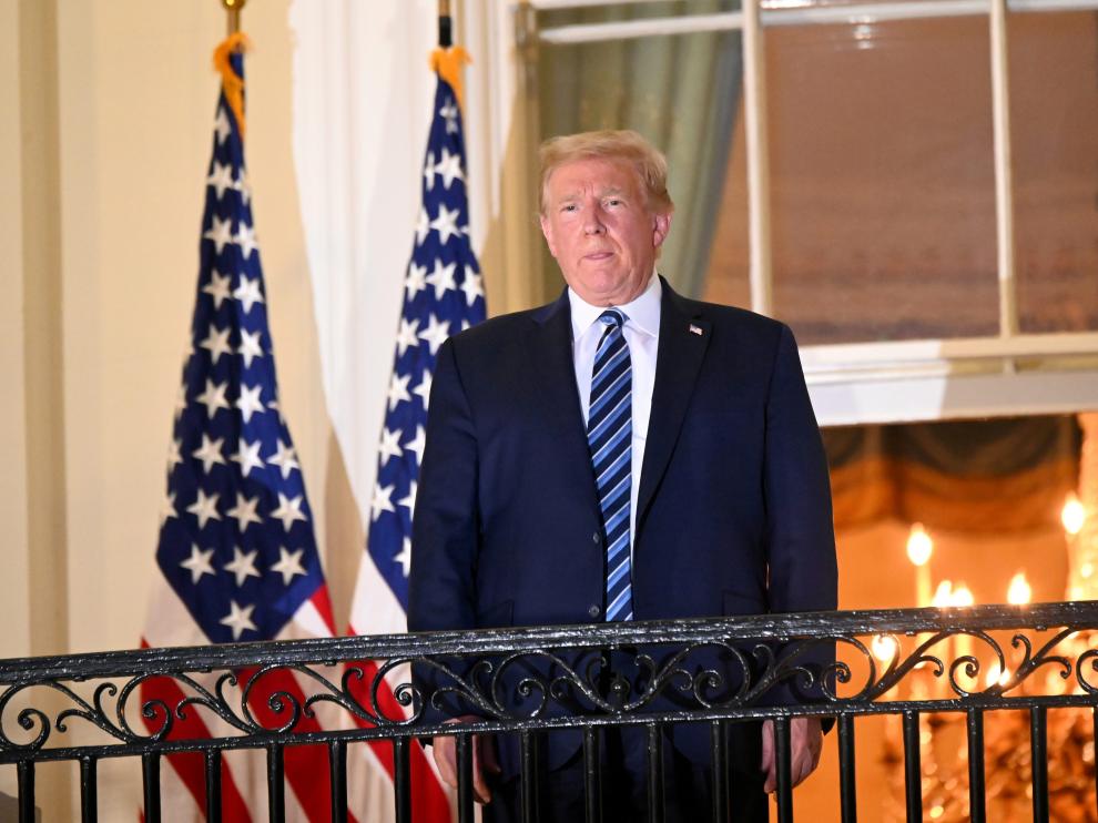 FILE PHOTO: U.S. President Donald Trump returns to the White House after being hospitalized at Walter Reed Medical Center for coronavirus disease (COVID-19), in Washington