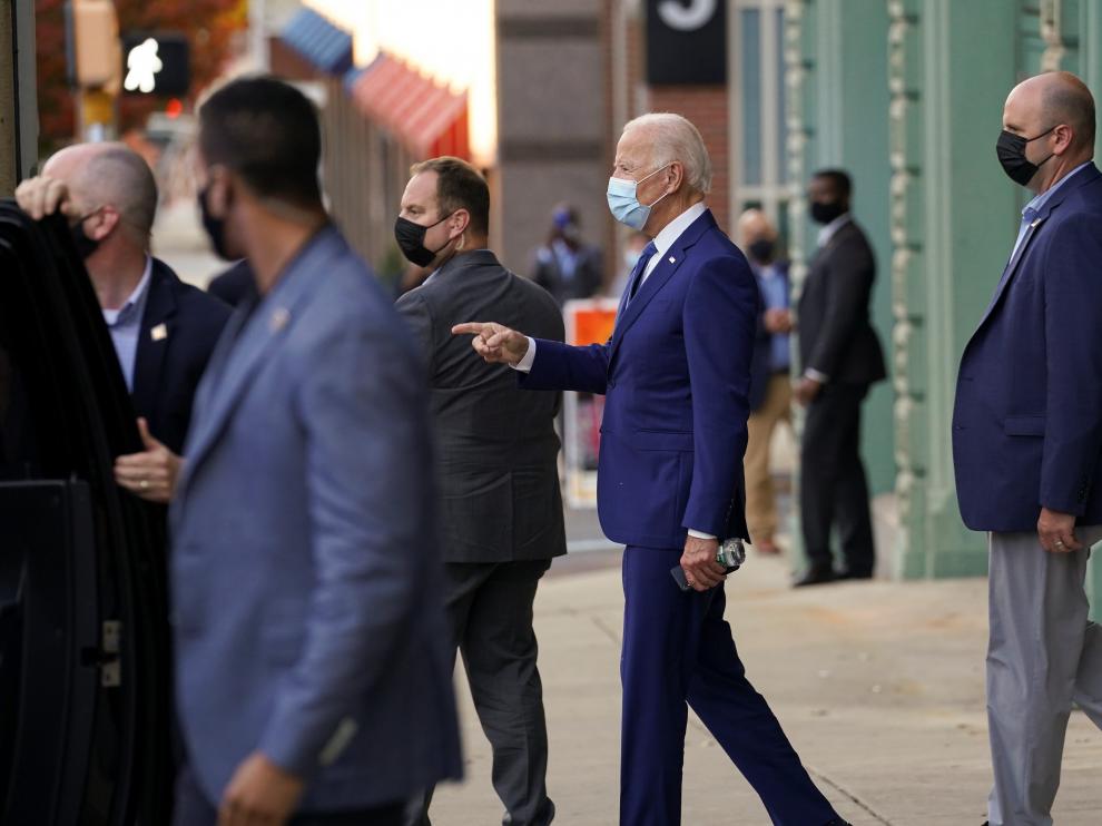 Joe Biden walks to his motorcade vehicle in Wilmington, Delaware