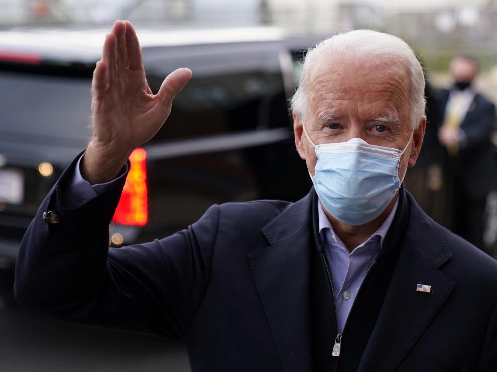 U.S. Democratic presidential nominee Joe Biden waves as he talks to reporters on Election Day in Wilmington
