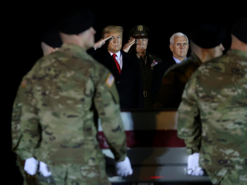 FILE PHOTO: U.S. President Donald Trump salutes the transfer case holding the remains of U.S. Army soldier Sergeant Gutierrez during a dignified transfer at Dover Air Force Base, in Dover, Delaware