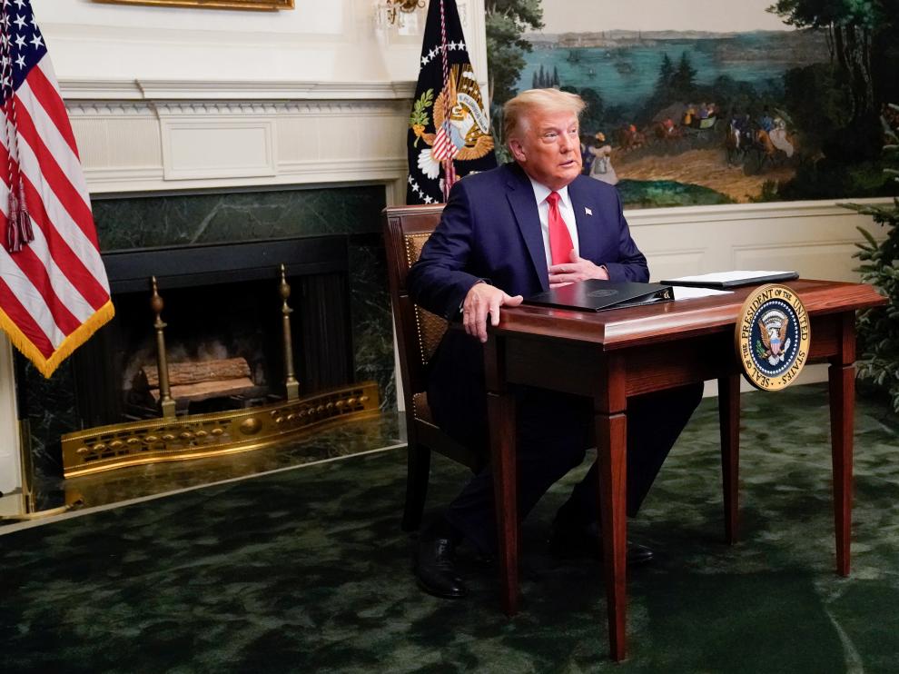 U.S. President Donald Trump arrives to a Thanksgiving video teleconference with members of the military forces at the White House in Washington