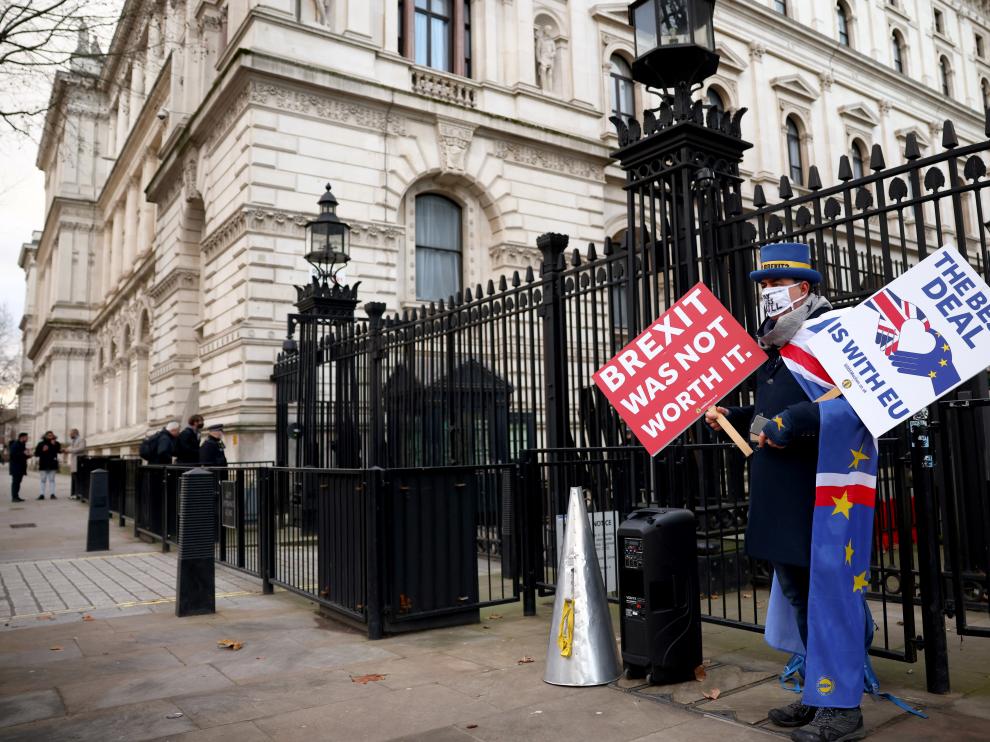 Anti-Brexit protester Steve Bray holds signs outside entrance to Downing Street in London