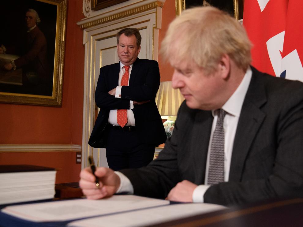 Britain's Prime Minister Boris Johnson signs the Brexit trade deal with EU