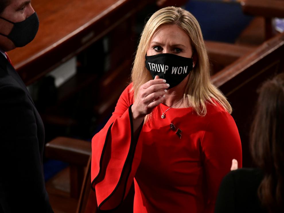 U.S. Rep. Marjorie Taylor Greene (R-GA) wears a "Trump Won" face mask as she arrives to take her oath of office as a member of the 117th Congress in Washington