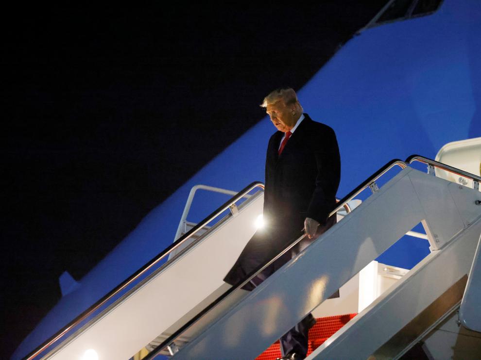 U.S. President Donald Trump disembarks from Air Force One at Joint Base Andrews in Maryland