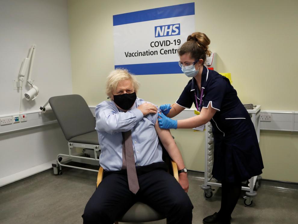 British Prime Minister Boris Johnson receives a dose of the Oxford/AstraZeneca COVID-19 vaccine in London