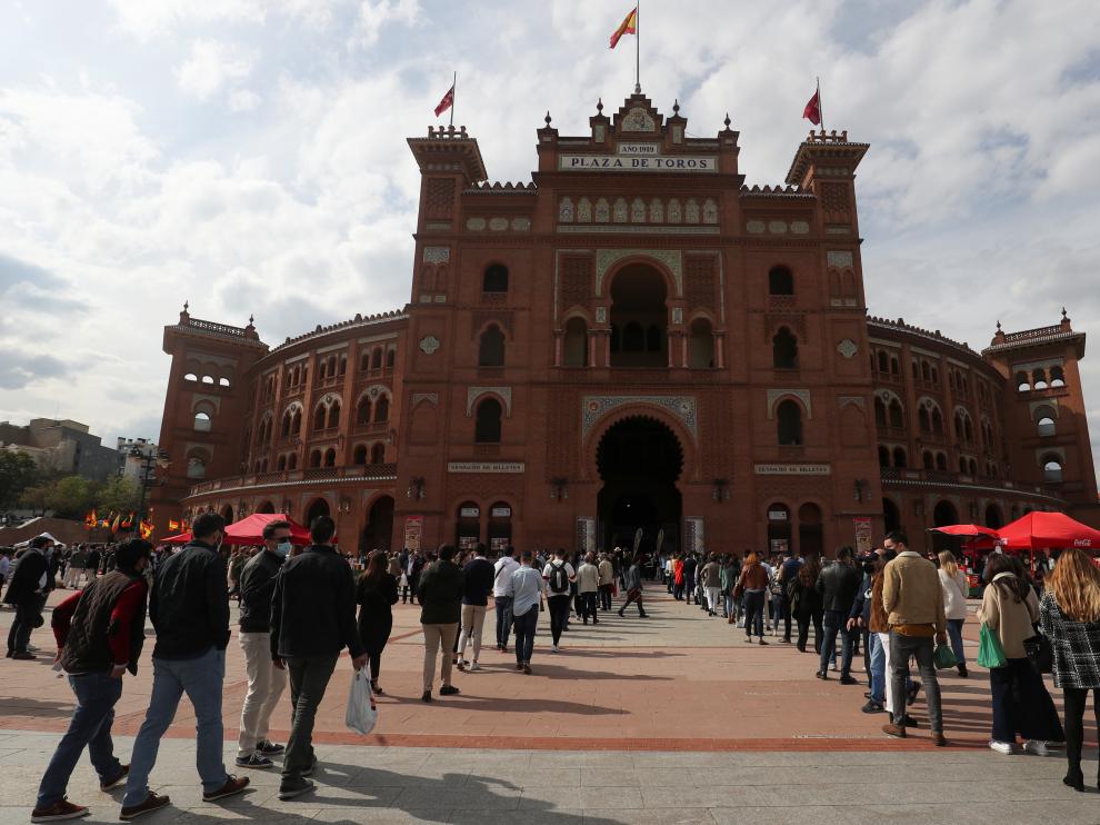 People wait outside Las Ventas bullring ahead of the first bullfight since the start of the COVID-19 pandemic, in Madrid