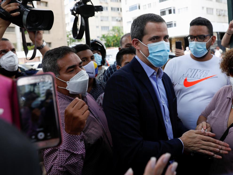 Venezuela's opposition leader Juan Guaido greets people, in Caracas