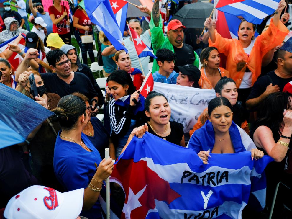 Emigres in the Little Havana neighborhood react to reports of protests in Cuba against its deteriorating economy, in Miami