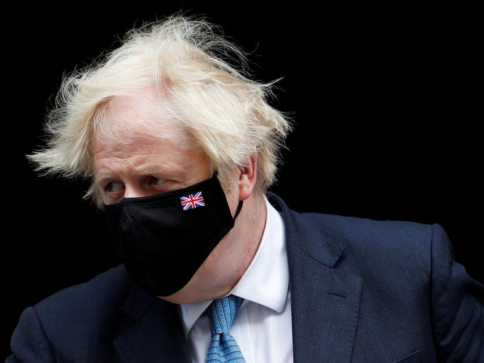 FILE PHOTO: Britain's PM Johnson walks on Downing Street in London