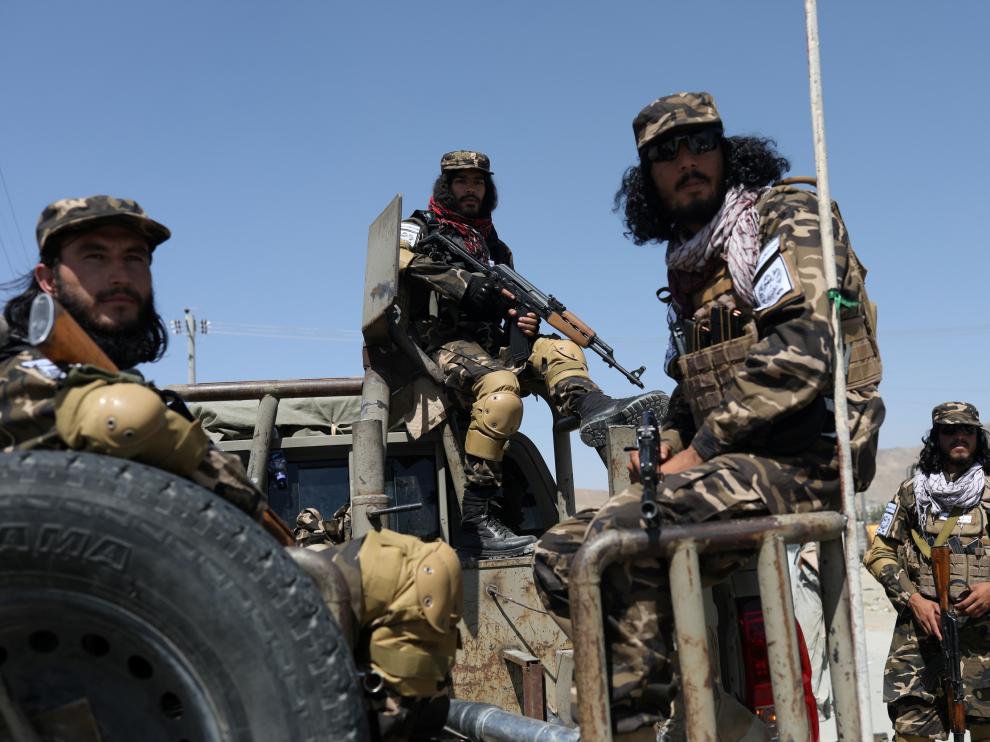 Members of the Taliban Intelligence Special Forces guard the military airfield in Kabul