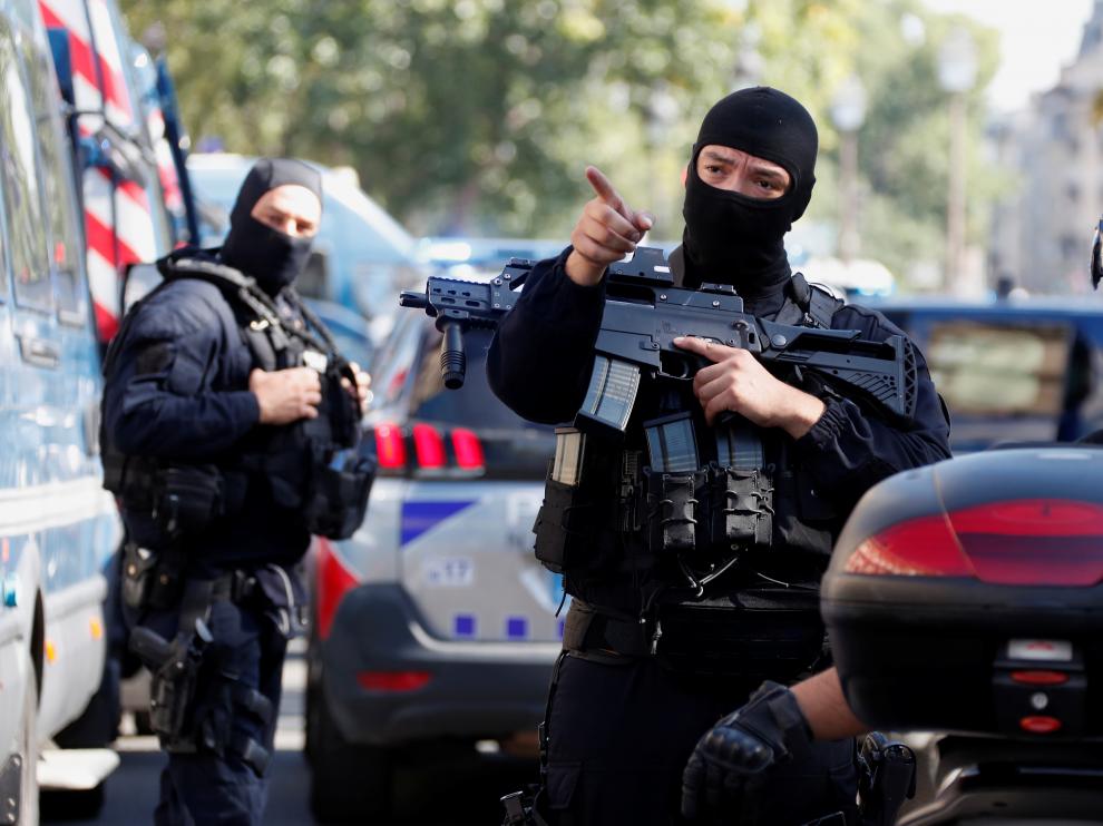 French police forces are seen near the Paris courthouse on the Ile de la Cite in Paris