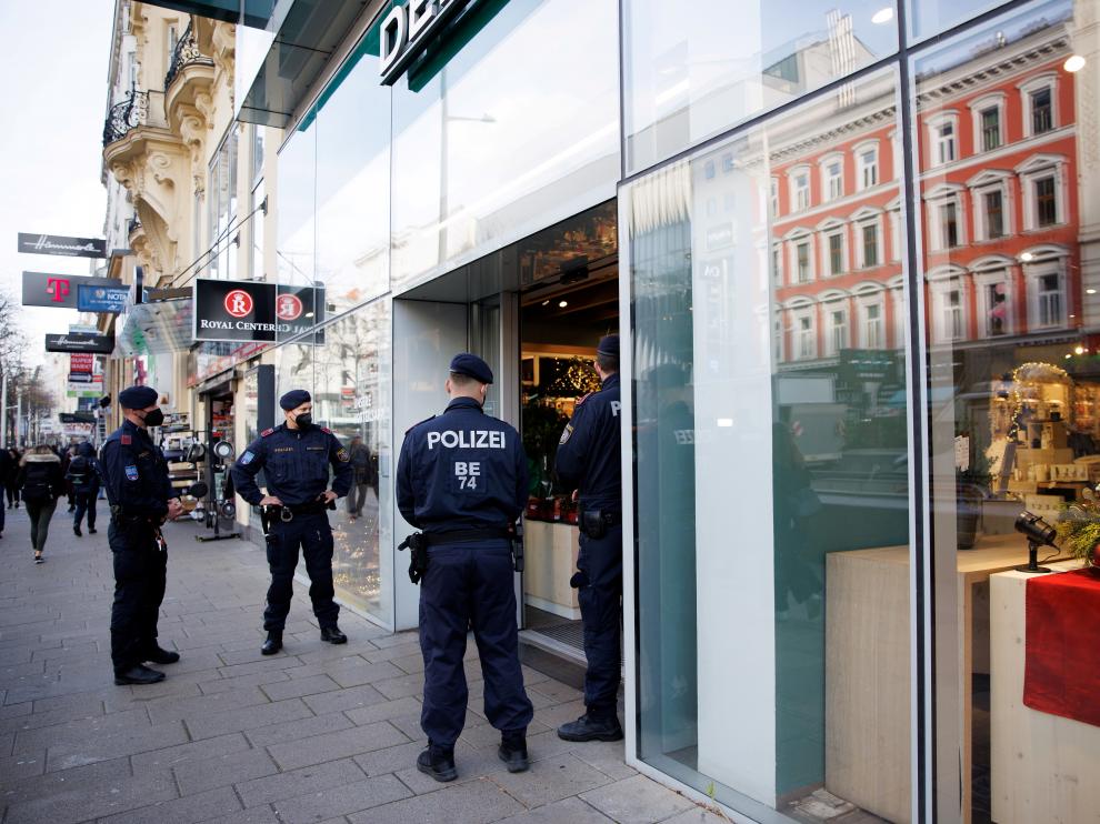 FILE PHOTO: Police patrol streets to check people's vaccination status