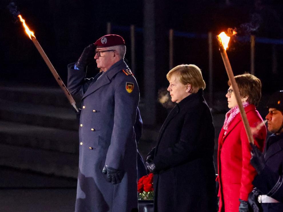 German Chancellor Angela Merkel smiles as she departs from the defence ministry after a Grand Tattoo (Grosser Zapfenstreich) ceremonial send-off for her in Berlin, Germany December 2, 2021. Odd Andersen/Pool via REUTERS GERMANY-MERKEL/CEREMONY