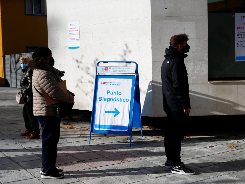 People queue to get tested for the coronavirus disease (COVID-19) after the Christmas holiday break, amid the COVID-19 pandemic, at Doce de Octubre Hospital in Madrid