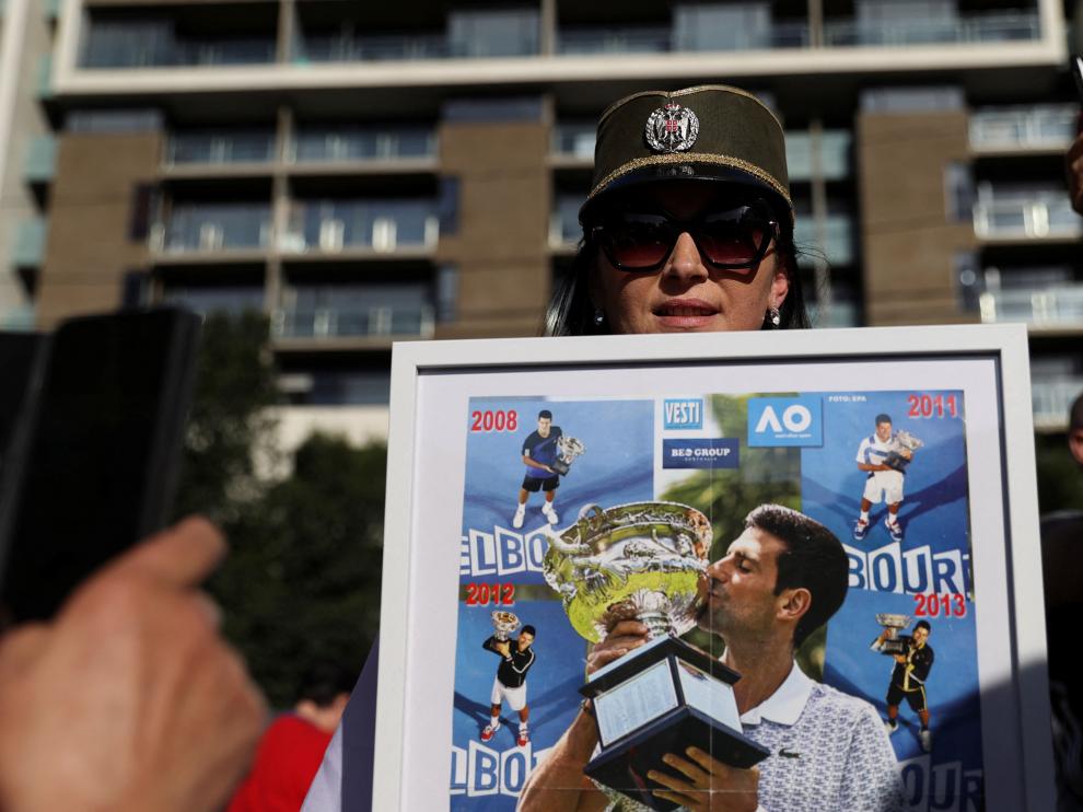 Supporters gather outside the hotel where Novak Djokovic is believed to be held in Melbourne