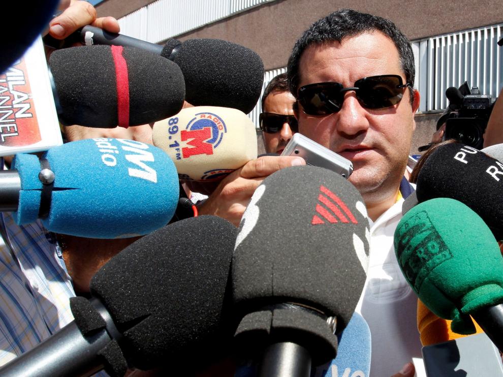 FILE PHOTO: Soccer agent Mino Raiola speaks to the media as he arrives at FC Barcelona's office in Barcelona