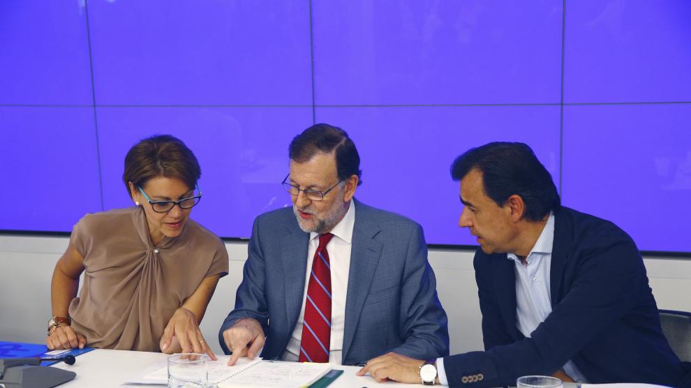 Rajoy, junto a Dolores de Cospedal y Martínez Maíllo, durante la Junta Directiva Nacional del PP.