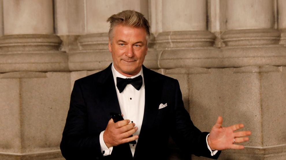 FILE PHOTO: Actor Alec Baldwin gestures before walking on the red carpet during the commemoration of the Elton John AIDS Foundation 25th year fall gala at the Cathedral of St. John the Divine in New York City