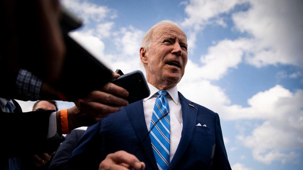 U.S. President Biden speaks to reporters while departing at Des Moines International Airport in Des Moines
