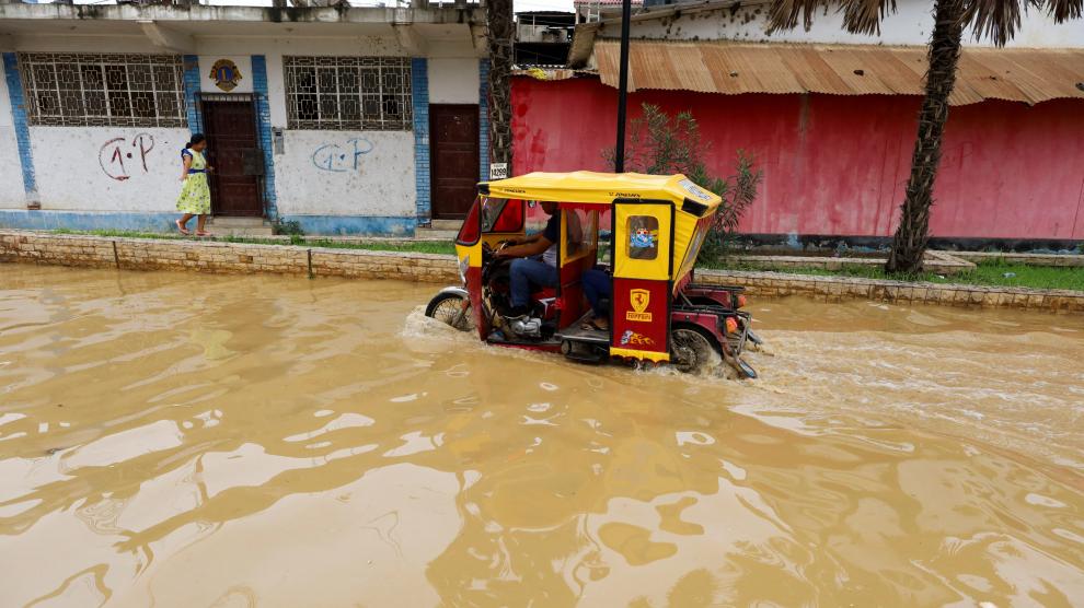 A man on horseback rides through the streets of the city of Tumbes, a town in northern Peru which has suffered flooding due to the rains caused by the direct influence of cyclone Yaku in Tumbes, Peru March 10, 2023. REUTERS/Sebastian Castaneda PERU-WEATHER/