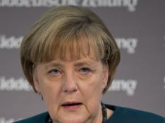 Merkel califica de "éxito" el rescate bancario español
