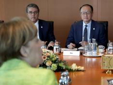 La directora gerente del FMI, Christine Lagarde, el presidente del BM, Jim Yong Kim, el director general de la OMC, Roberto Azevêdo y la caciller alemana Angela Merkel.