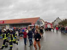 People react at the scene after a car ploughed into a carnival parade injuring several people in Volkmarsen